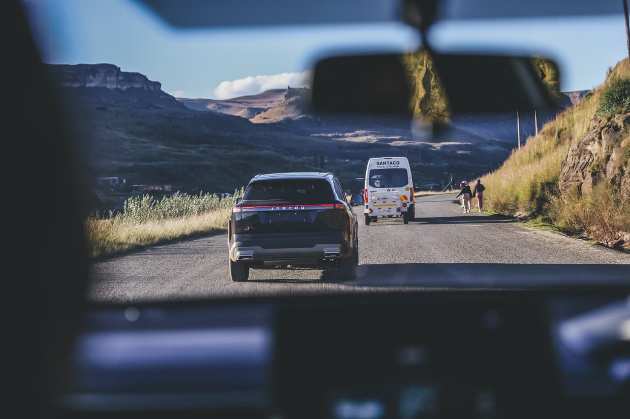 Cars driving on rural mountain road