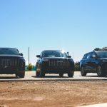 Three black Jaecoo SUVs parked side by side