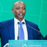 Man speaking at CAF podium