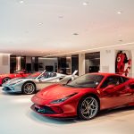 Luxury Ferrari sports cars in modern showroom