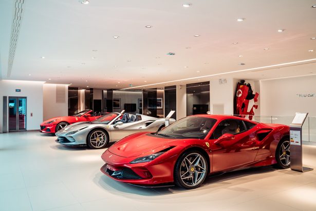 Luxury Ferrari sports cars in modern showroom
