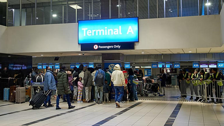Passengers queuing at Terminal A airport check-in