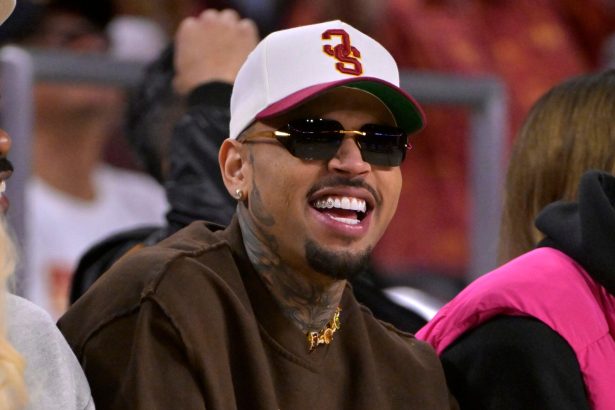 Man wearing sunglasses and cap at sports event