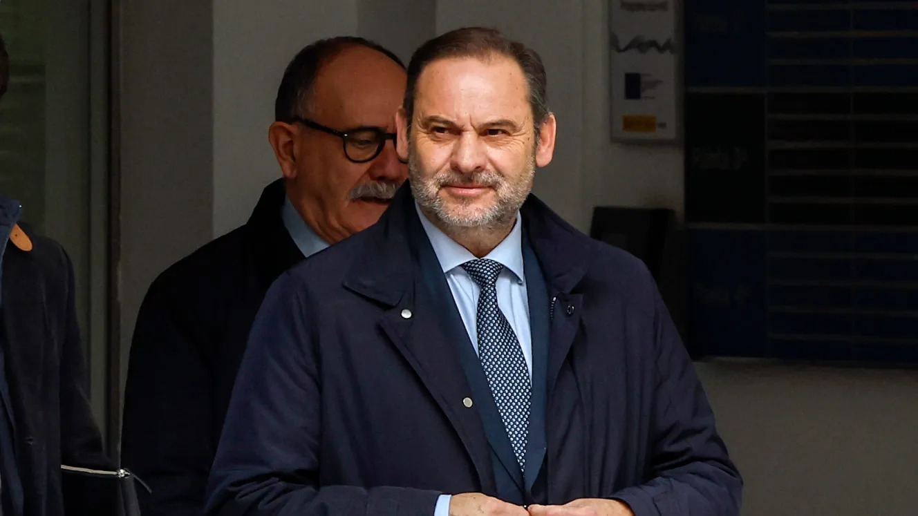 Man in suit exiting building entrance