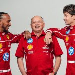 Three Ferrari racing team members in red uniforms