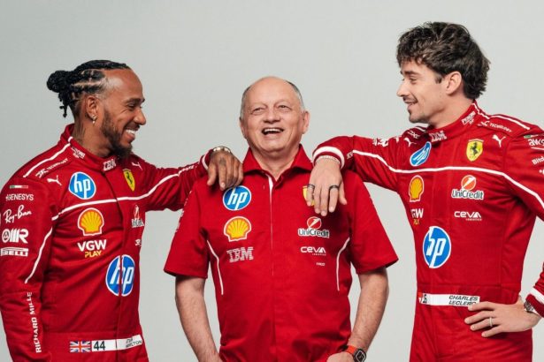 Three Ferrari racing team members in red uniforms