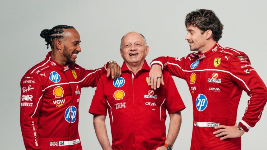 Three Ferrari racing team members in red uniforms