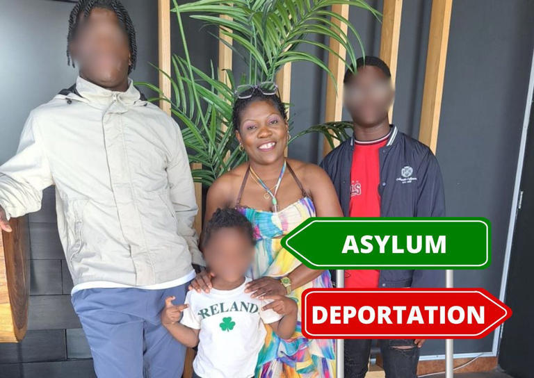 Family standing indoors with asylum and deportation signs