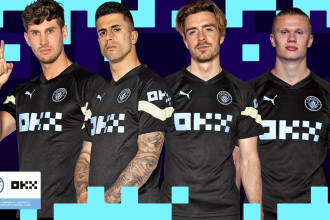 Four footballers in black Manchester City kit