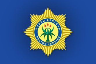 South African Police Service badge on blue background