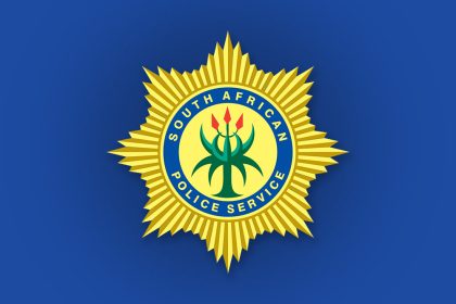 South African Police Service badge on blue background