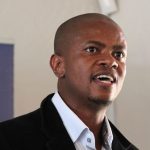Man speaking at indoor event