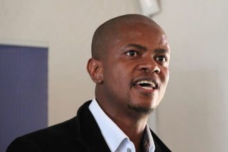Man speaking at indoor event