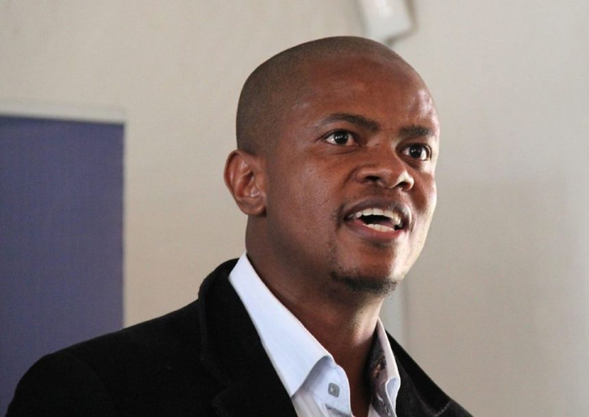Man speaking at indoor event