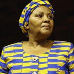 Woman in blue and yellow traditional attire
