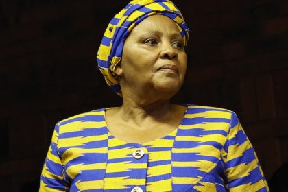 Woman in blue and yellow traditional attire