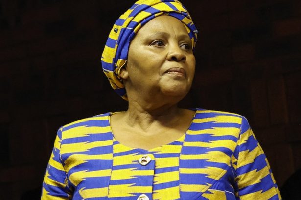 Woman in blue and yellow traditional attire
