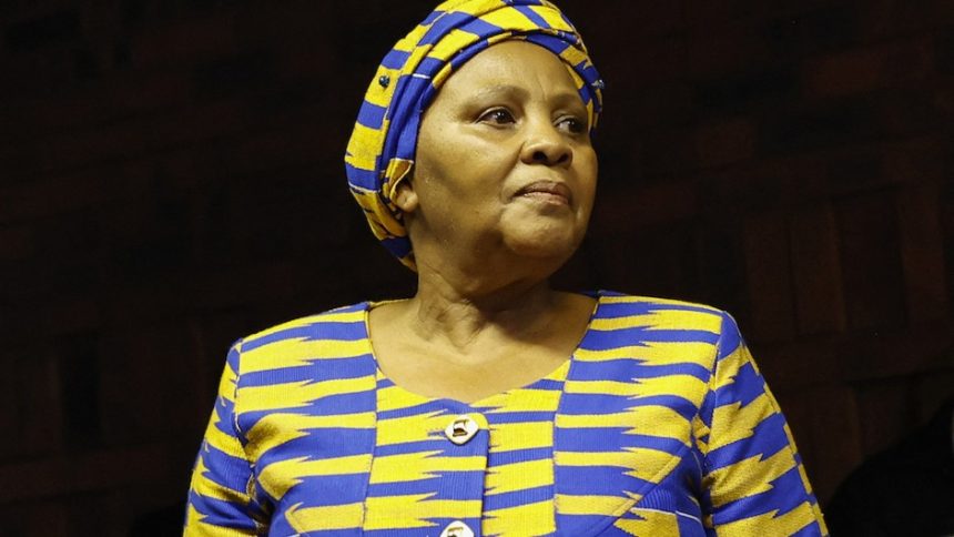 Woman in blue and yellow traditional attire