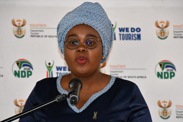 Woman speaking at tourism press briefing podium