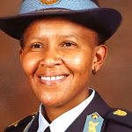 Smiling police officer in formal uniform portrait