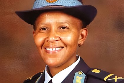Smiling police officer in formal uniform portrait