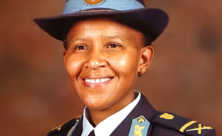Smiling police officer in formal uniform portrait