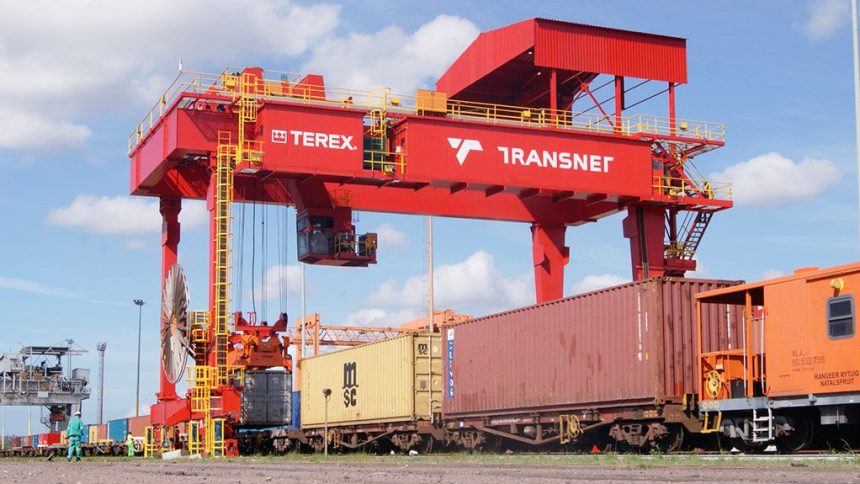 Transnet gantry crane loading containers onto freight train