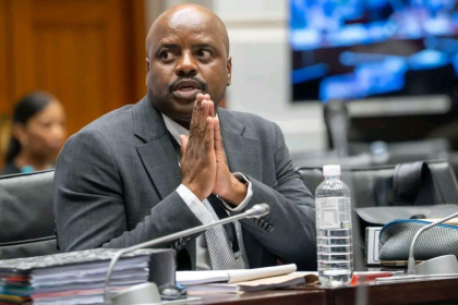 Man in suit at courtroom hearing table