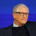 A portrait of Bill Gates wearing glasses.