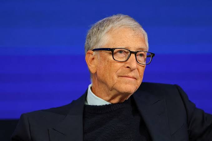 A portrait of Bill Gates wearing glasses.