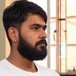 akilesh gupta in white shirt looking sideways indoors